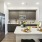 a kitchen with a large island and chairs