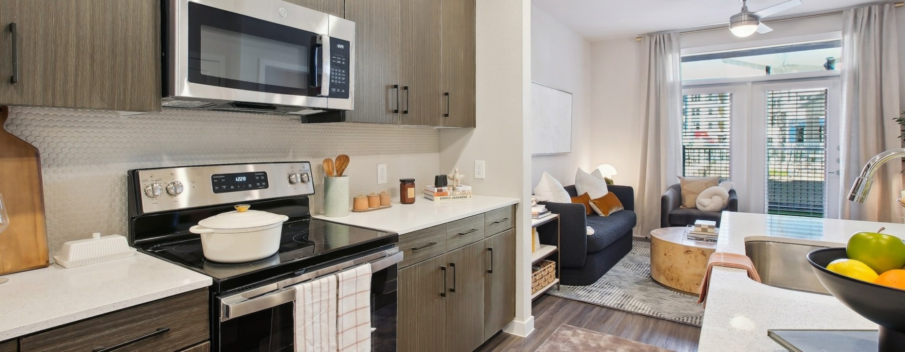 a kitchen with dark cabinets
