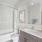 Guest bathroom with garden tub and natural stone countertops